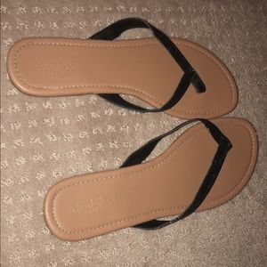 Black sparkly strapped flip flops